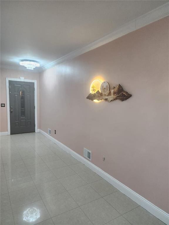 entrance foyer with crown molding, baseboards, light tile patterned flooring, and visible vents