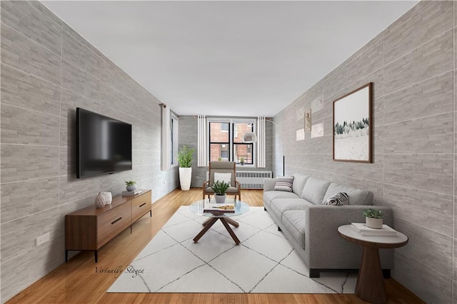 345 Webster Ave Unit 3N, Brooklyn, NY 11230 - living room with tile walls, radiator heating unit, and wood finished floors