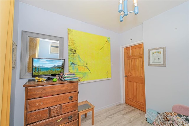 interior space featuring light wood-style floors and baseboards