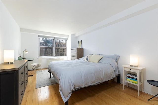 bedroom featuring light wood-style flooring