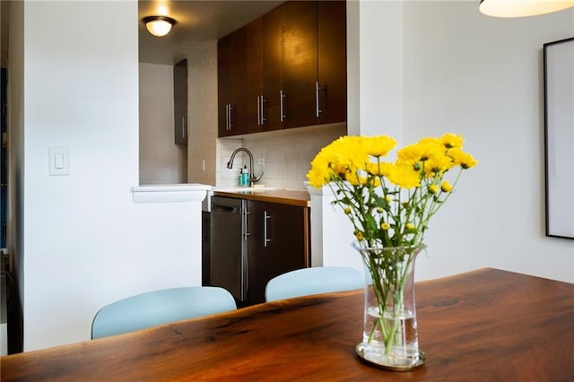 135 Ocean Pkwy Unit 4M, Brooklyn, NY 11218 - kitchen with tasteful backsplash, dark brown cabinetry, dishwashing machine, and tile counters