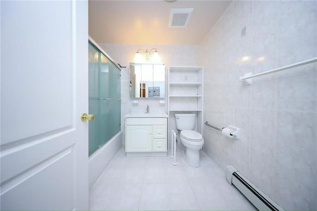 bathroom featuring shower / bath combination with glass door, visible vents, toilet, tile patterned floors, and a baseboard heating unit
