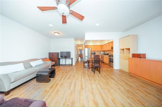 living area featuring recessed lighting, ceiling fan, and light wood-type flooring