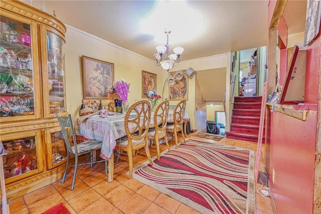 dining area featuring tile patterned floors, stairway, crown molding, and a chandelier
