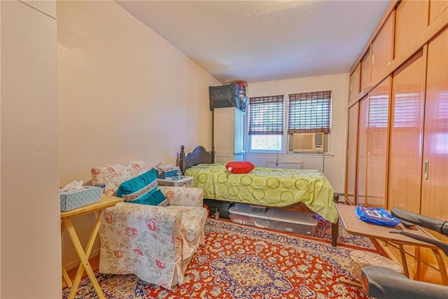 bedroom featuring a baseboard radiator and cooling unit