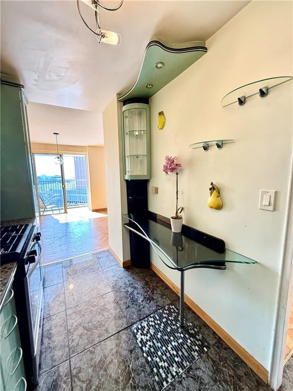corridor featuring baseboards
