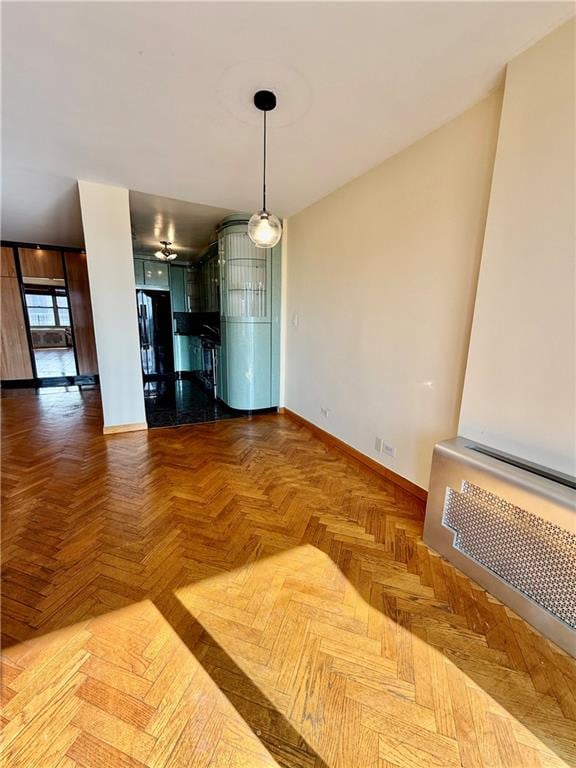 unfurnished dining area with baseboards