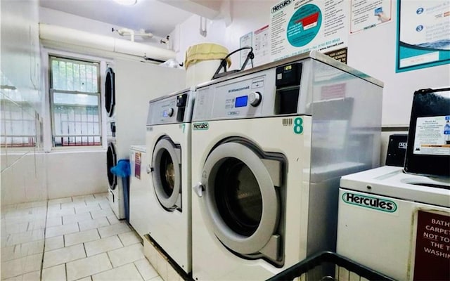 common laundry area featuring independent washer and dryer and light tile patterned floors