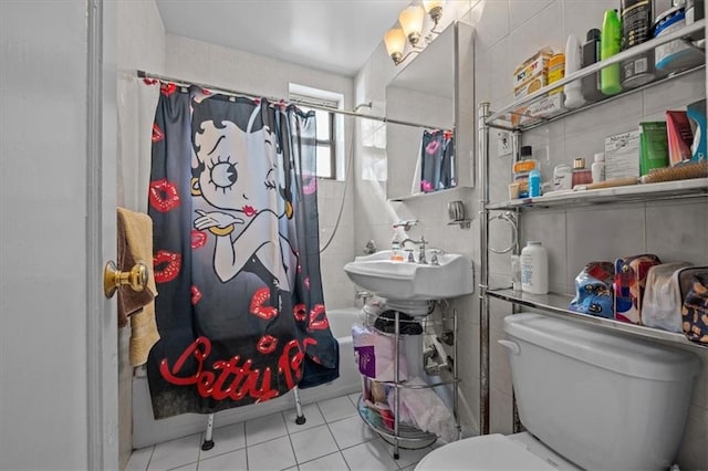 full bath with toilet, tile patterned flooring, and shower / bath combo with shower curtain