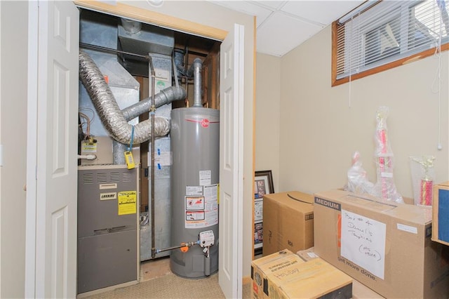 utility room featuring water heater