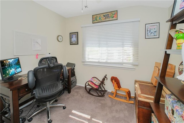 carpeted office with baseboards and vaulted ceiling