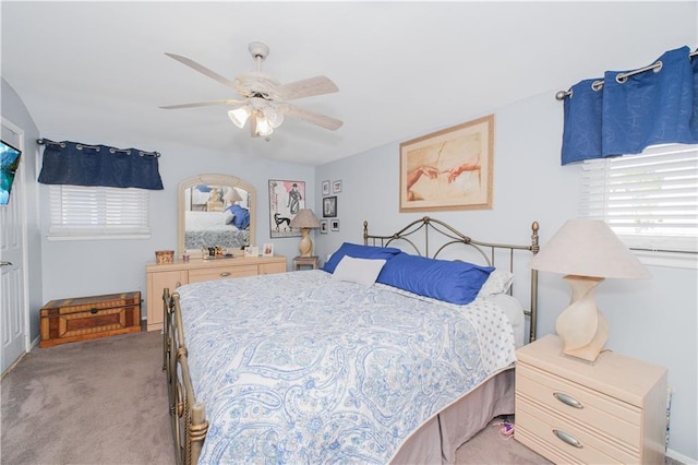 bedroom featuring ceiling fan and light carpet