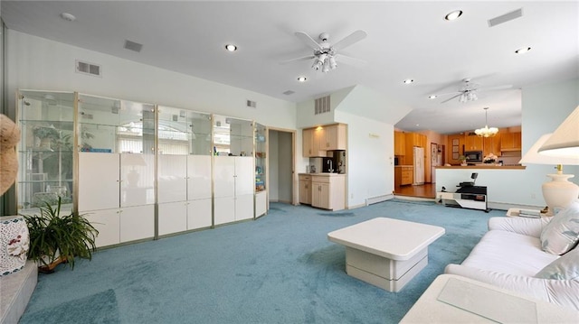 carpeted living room with ceiling fan with notable chandelier and visible vents