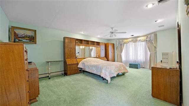 bedroom featuring carpet floors, a baseboard heating unit, recessed lighting, and visible vents