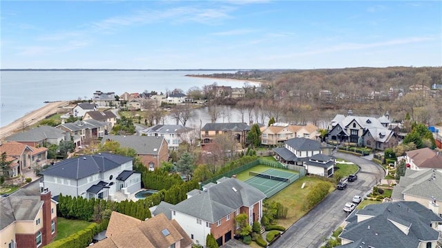 bird's eye view featuring a residential view and a water view