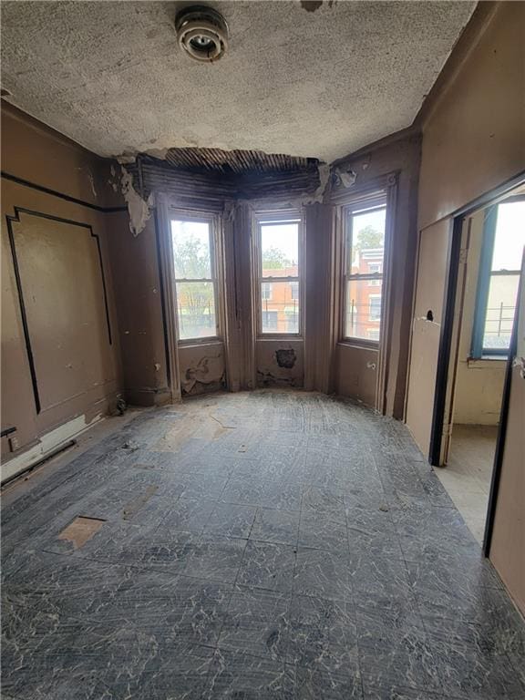 interior space featuring a textured ceiling