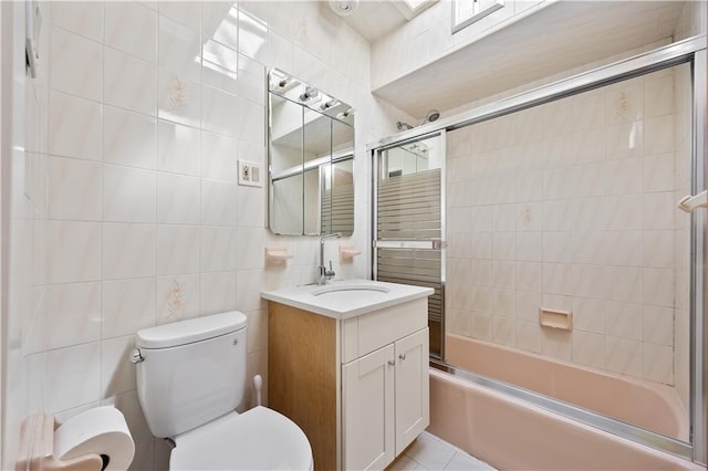 1933 E 28th St, Brooklyn, NY 11229 - full bath featuring tile walls, combined bath / shower with glass door, vanity, and toilet
