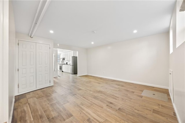 1933 E 28th St, Brooklyn, NY 11229 - unfurnished living room featuring light wood-style flooring, baseboards, and recessed lighting