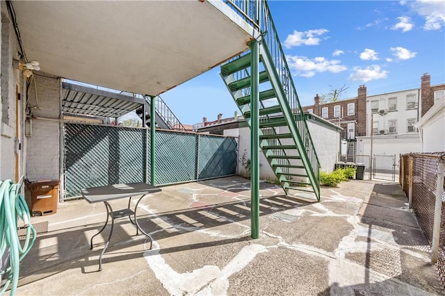 1933 E 28th St, Brooklyn, NY 11229 - view of patio featuring stairs and fence