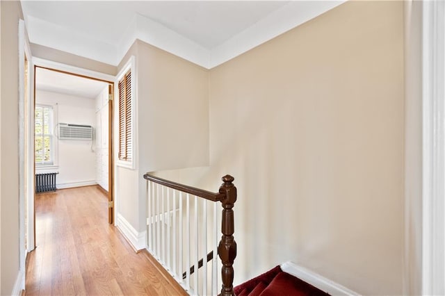 1933 E 28th St, Brooklyn, NY 11229 - hall featuring wood finished floors, a wall mounted air conditioner, an upstairs landing, and baseboards