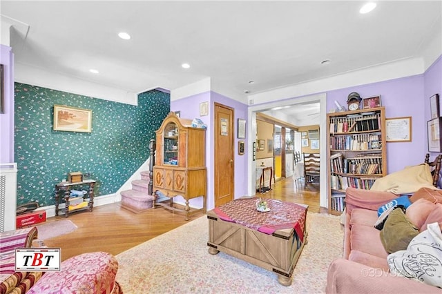 2052 E 28th St, Brooklyn, NY 11229 - living room with wood finished floors, recessed lighting, wallpapered walls, and stairway