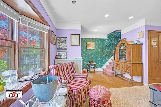2052 E 28th St, Brooklyn, NY 11229 - sitting room with wood finished floors, baseboards, wallpapered walls, recessed lighting, and stairway