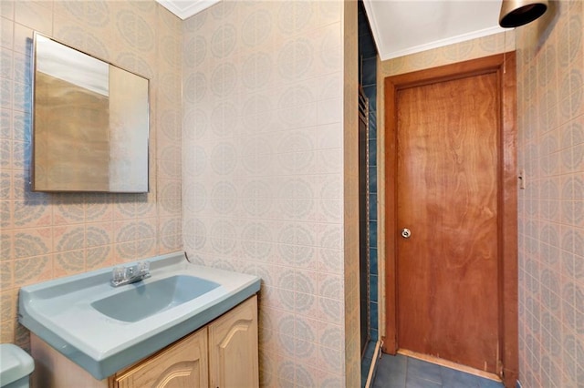 full bathroom featuring tile walls, ornamental molding, tile patterned floors, and vanity