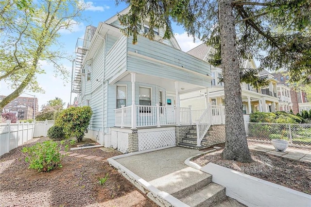 222 Albemarle Rd, Brooklyn, NY 11218 - view of front of property with covered porch, fence, and stairway