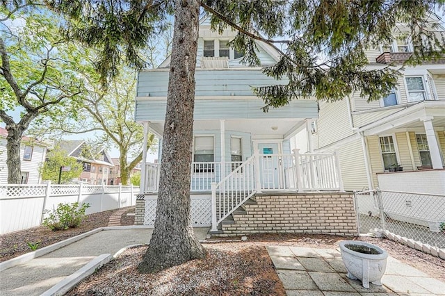 222 Albemarle Rd, Brooklyn, NY 11218 - view of front of property with covered porch, fence, and stairs