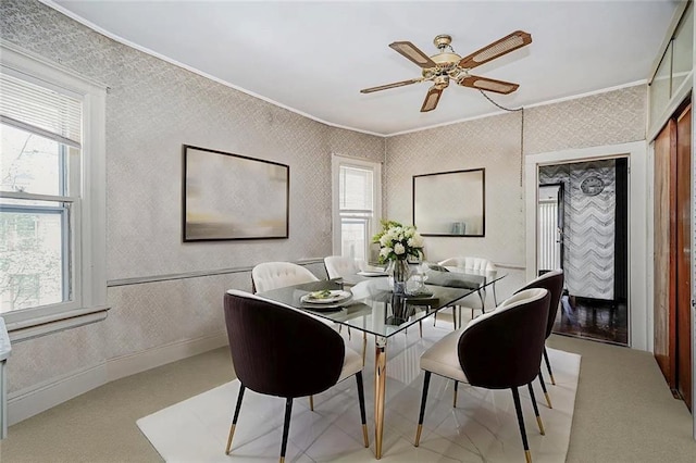 222 Albemarle Rd, Brooklyn, NY 11218 - carpeted dining area featuring ornamental molding, wallpapered walls, and a ceiling fan