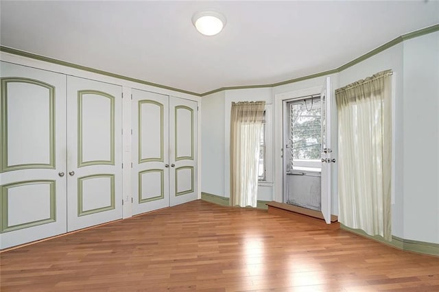 222 Albemarle Rd, Brooklyn, NY 11218 - unfurnished bedroom featuring light wood-style floors, ornamental molding, and baseboards
