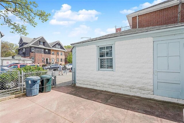 222 Albemarle Rd, Brooklyn, NY 11218 - view of home's exterior with fence, a chimney, and a patio area
