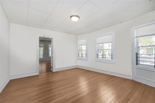 222 Albemarle Rd, Brooklyn, NY 11218 - spare room with hardwood / wood-style flooring, a drop ceiling, and baseboards