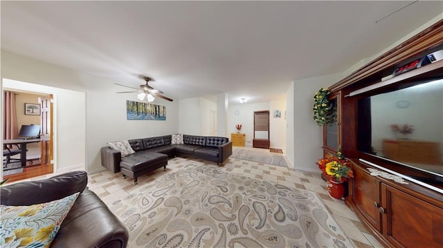 living room featuring a ceiling fan