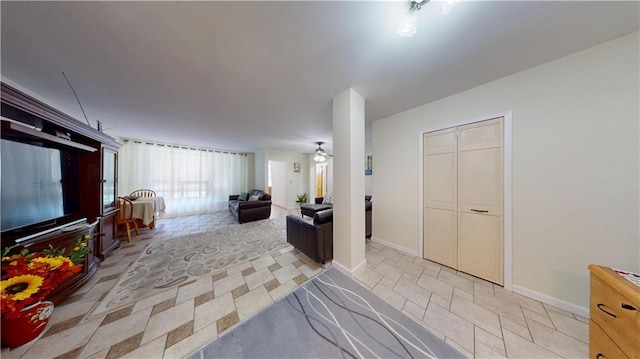 hall featuring baseboards