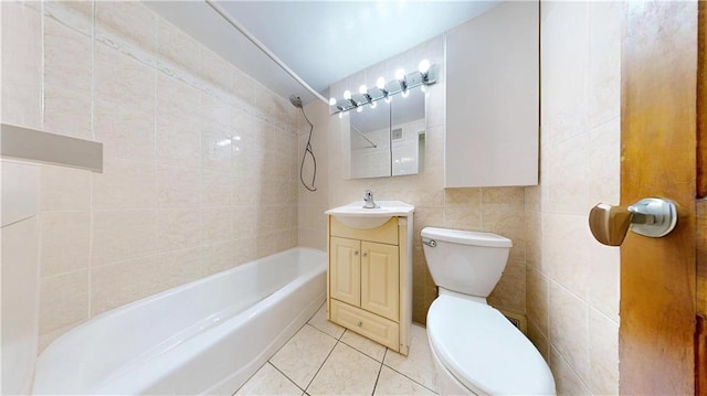 bathroom with toilet, shower / washtub combination, tile walls, vanity, and tile patterned floors