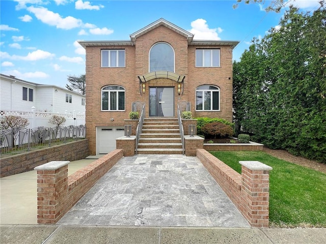 166 Pinewood Ave, Staten Island, NY 10306 - view of front of property featuring driveway, brick siding, and a garage
