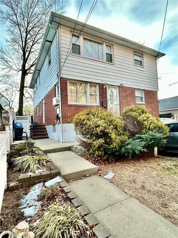 282 Locust Ave, Staten Island, NY 10306 - view of front of property with brick siding