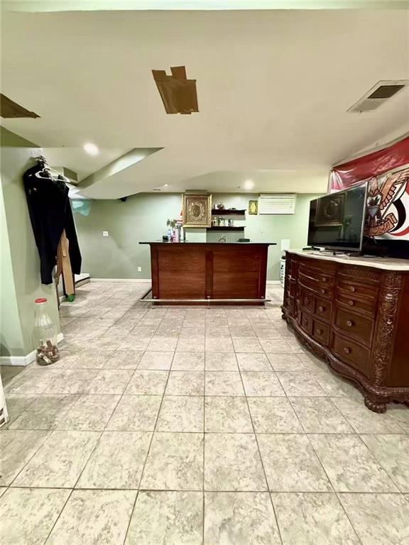 welcome area with a bar and visible vents