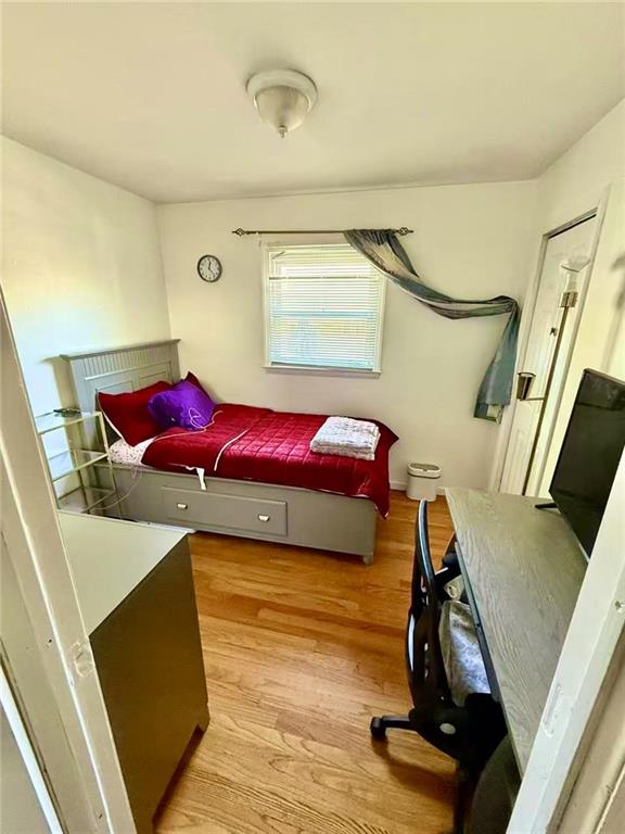 bedroom featuring light wood-style flooring