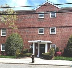 view of front of house featuring brick siding
