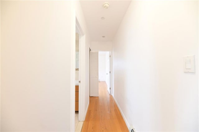 69 Bay 20th St Unit 3A, Brooklyn, NY 11214 - hallway with light wood-type flooring and baseboards