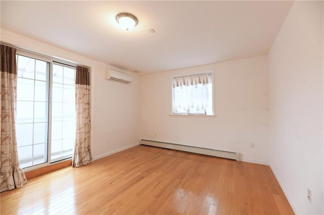69 Bay 20th St Unit 3A, Brooklyn, NY 11214 - empty room with a baseboard heating unit, a wall unit AC, plenty of natural light, and light wood finished floors