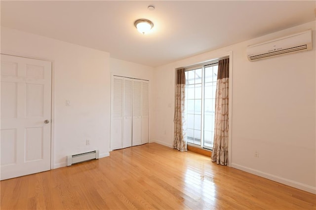 69 Bay 20th St Unit 3A, Brooklyn, NY 11214 - unfurnished bedroom with a baseboard radiator, a wall unit AC, multiple windows, and light wood-style floors