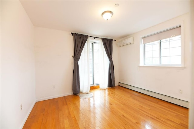 69 Bay 20th St Unit 3A, Brooklyn, NY 11214 - unfurnished room featuring a wall mounted air conditioner, plenty of natural light, baseboard heating, and light wood-type flooring