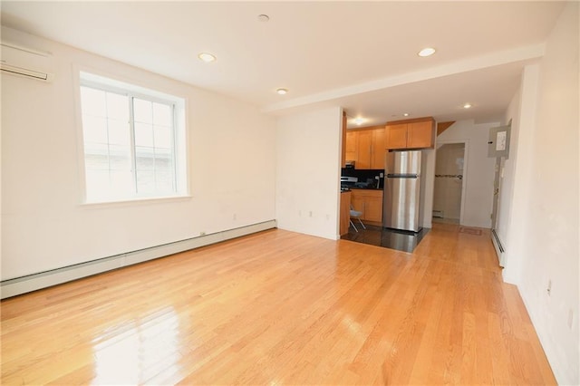 69 Bay 20th St Unit 3A, Brooklyn, NY 11214 - unfurnished living room with a baseboard heating unit, baseboard heating, light wood-style floors, recessed lighting, and a wall mounted AC