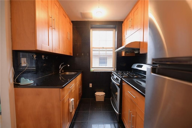 69 Bay 20th St Unit 3A, Brooklyn, NY 11214 - kitchen featuring appliances with stainless steel finishes, a sink, and dark tile patterned flooring