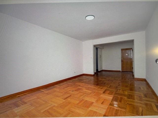 2727 Ocean Pkwy Unit A14, Brooklyn, NY 11235 - unfurnished room with baseboards and lofted ceiling