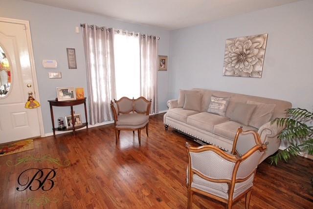 living area with wood finished floors
