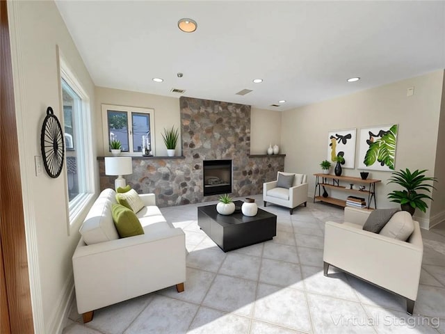 living area with recessed lighting, a stone fireplace, baseboards, and light tile patterned flooring